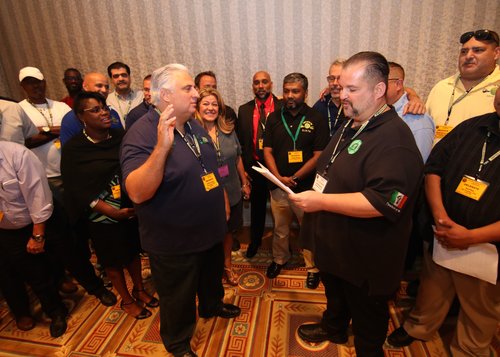 image of Samuelsen swearing in Utano as TWU Local 100 president